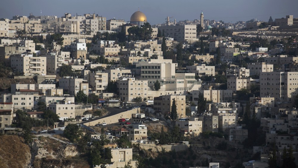 The Arab East Jerusalem neighbourhood of Ras al-Amud is seen in front of the Dome of the Rock