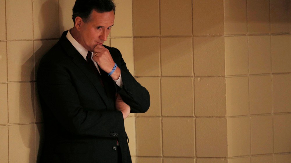 Republican U.S. presidential candidate and former U.S. Senator Rick Santorum waits his turn to speak during the Voters First Presidential Forum in Manchester, New Hampshire Aug. 3, 2015. (Brian Snyder/Reuters)