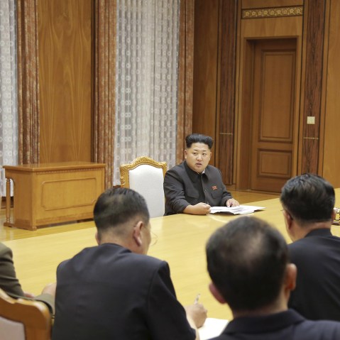 North Korean leader Kim Jong Un (back C) speaks at an emergency meeting of the Workers' Party of Korea (WPK) Central Military Commission, in this photo released by North Korea's Korean Central News Agency in Pyongyang on Aug. 21, 2015. (KCNA/Reuters)