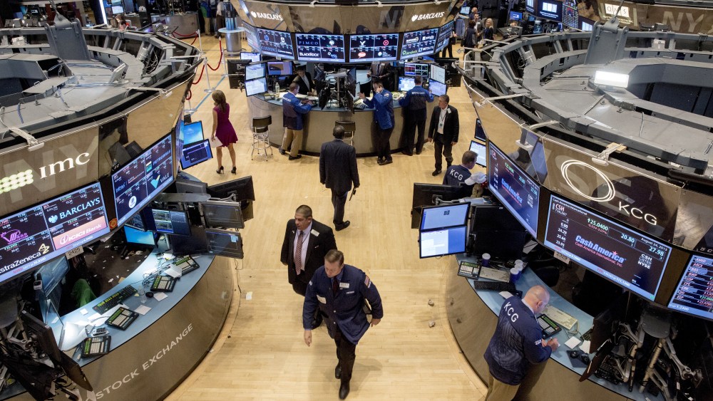Traders exit the trading floor after the closing bell at the New York Stock Exchange on Aug. 24, 2015. (Photo by Brendan McDermid/Reuters)