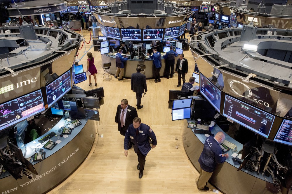 Traders exit the trading floor after the closing bell at the New York Stock Exchange on Aug. 24, 2015. (Photo by Brendan McDermid/Reuters)