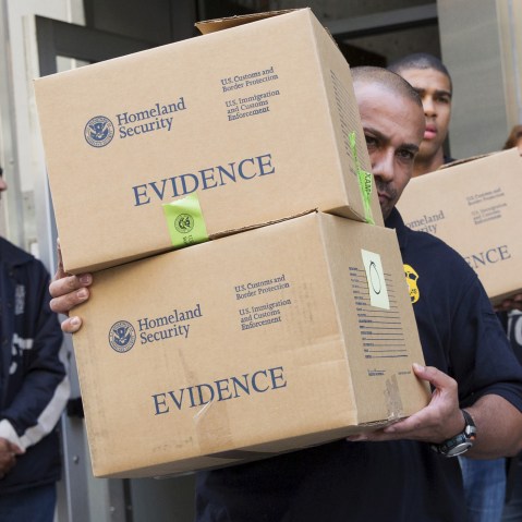 Law enforcement officers take evidence from the Manhattan offices of Rentboy.com in New York on Aug. 25, 2015. (Photo by Brendan McDermid/Reuters)