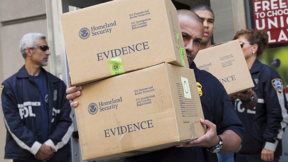 Law enforcement officers take evidence from the Manhattan offices of Rentboy.com in New York on Aug. 25, 2015. (Photo by Brendan McDermid/Reuters)