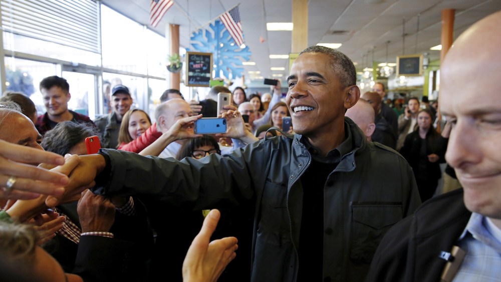 U.S. President Barack Obama greets patrons in Snow City Cafe in Anchorage, Ala. on Sept. 1, 2015. (Photo by Jonathan Ernst/Reuters)