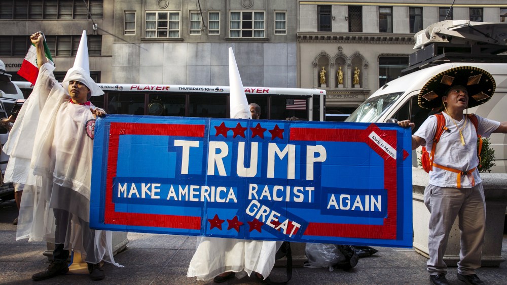 Demonstrators stand outside of Trump Towers to protest Donald Trump's candidacy for U.S. President in NY, Sept. 3, 2015.