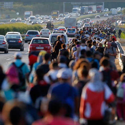 Migrants march along the highway towards the border with Austria, out of Budapest, Hungary, September 4, 2015. (Photo by Laszlo Balogh/Reuters)