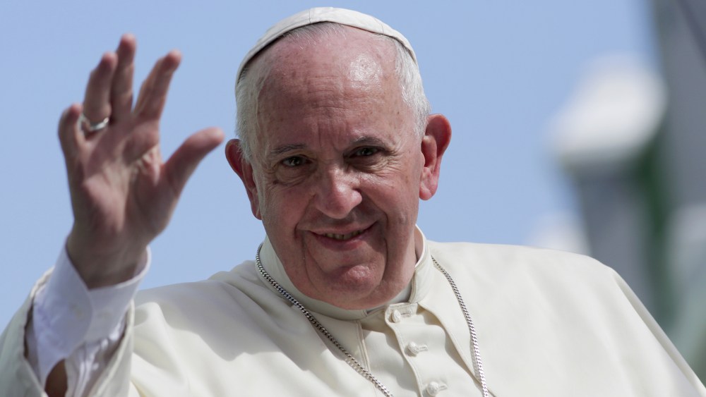 Pope Francis waves while riding through Santiago de Cuba before departing to the United States, Sept. 22, 2015. (Photo by Enrique de la Osa/Reuters)