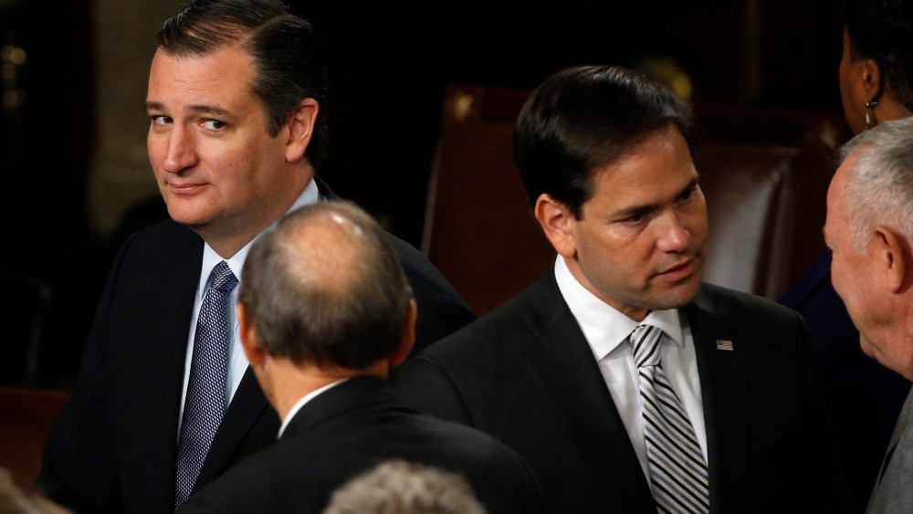 Presidential candidate Ted Cruz looks over at rival candidate Marco Rubio before a joint meeting of the U.S. Congress in the House of Representatives Chamber, Sept. 24, 2015. (Photo by James Lawler Duggan/Reuters)