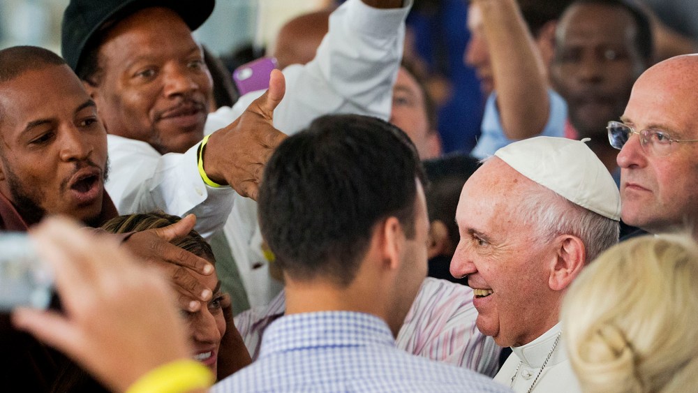 Supporters greet Pope Francis at the Catholic Charities office in Washington, Sept. 24, 2015. (Photo by Pool/Reuters)