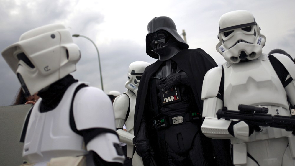 People dress up as "Darth Vader" (C) and "Stormtroopers" from the movie "Star Wars." (Photo by Jon Nazca/Reuters)