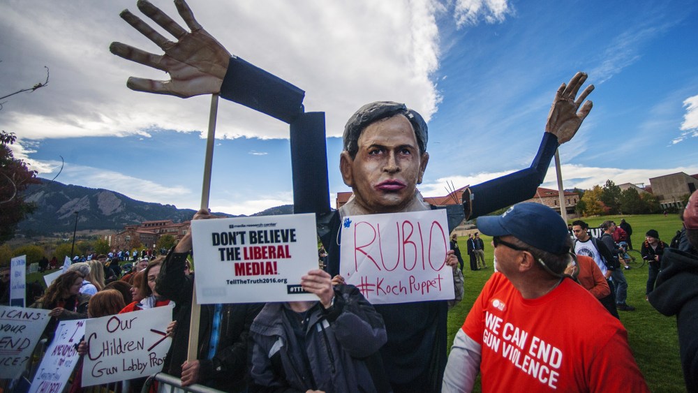 Students and protesters gather at the "Free Speech Zone" across the street from CNBC's U.S. Republican presidential debate in Boulder, Colo., Oct. 28, 2015. (Photo by Evan Semon/Reuters)