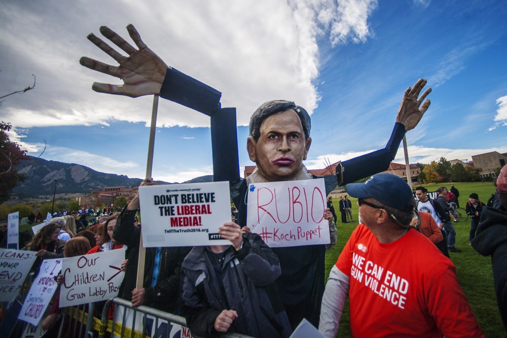 Students and protesters gather at the "Free Speech Zone" across the street from CNBC's U.S. Republican presidential debate in Boulder, Colo., Oct. 28, 2015. (Photo by Evan Semon/Reuters)