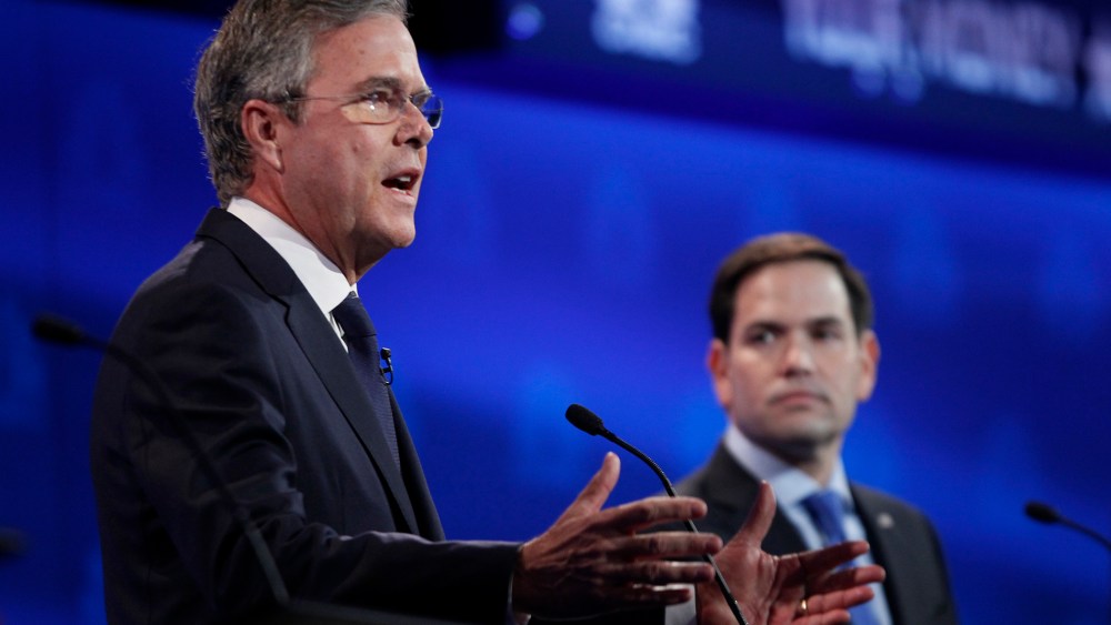 Republican U.S. presidential candidate former Governor Jeb Bush speaks as U.S. Senator Marco Rubio looks on at the 2016 U.S. Republican presidential candidates debate held by CNBC in Boulder, Colo, Oct. 28, 2015. (Photo by Rick Wilking/Reuters)
