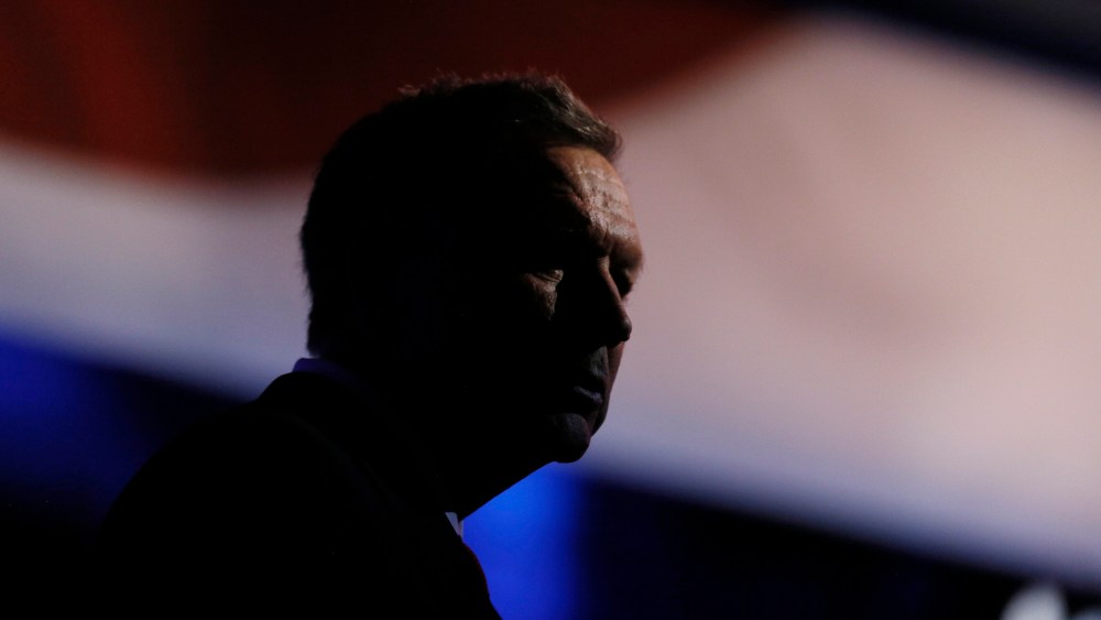 Republican U.S. presidential candidate and Ohio Governor John Kasich stands at his podium after the stage lights dimmed following the 2016 U.S. Republican presidential debate held by CNBC in Boulder, Colo., Oct. 28, 2015. (Photo by Rick Wilking/Reuters)