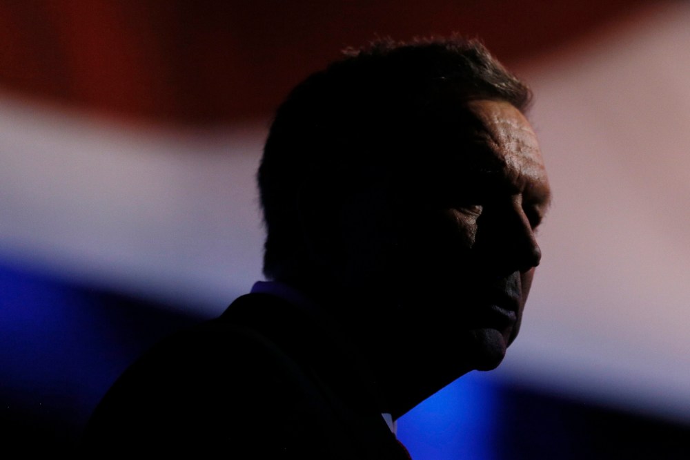 Republican U.S. presidential candidate and Ohio Governor John Kasich stands at his podium after the stage lights dimmed following the 2016 U.S. Republican presidential debate held by CNBC in Boulder, Colo., Oct. 28, 2015. (Photo by Rick Wilking/Reuters)