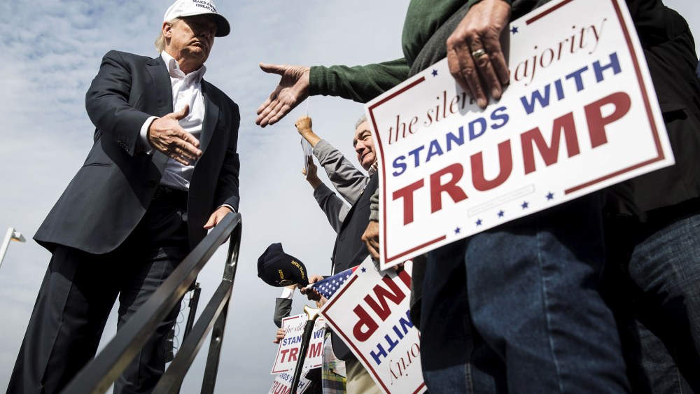 U.S. Republican presidential candidate Donald Trump shakes hands with a supporter during a campaign rally at the USS Wisconsin battleship in Norfolk, Va., Oct. 31, 2015. (Photo by Joshua Roberts/Reuters)