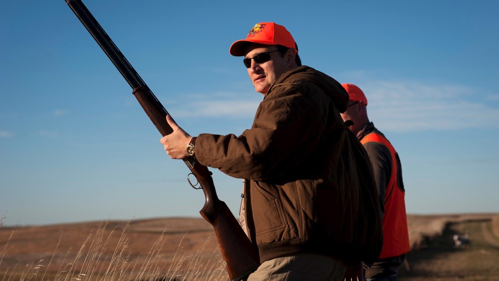 U.S. Republican presidential candidate Sen. Ted Cruz pauses before heading further down field during the Col. Bud Day Pheasant Hunt hosted by Congressman Steve King outside of Akron, Ia., Oct. 31, 2015. (Photo by Mark Kauzlarich/Reuters)