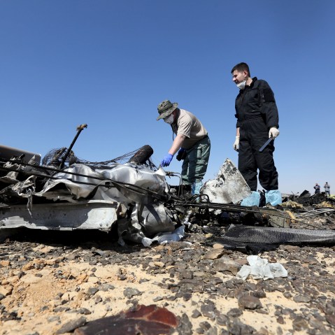 Military investigators from Russia check debris from a Russian airliner at its crash site at the Hassana area in Arish city, north Egypt, Nov. 1, 2015. (Photo by Mohamed Abd El Ghany/Reuters)