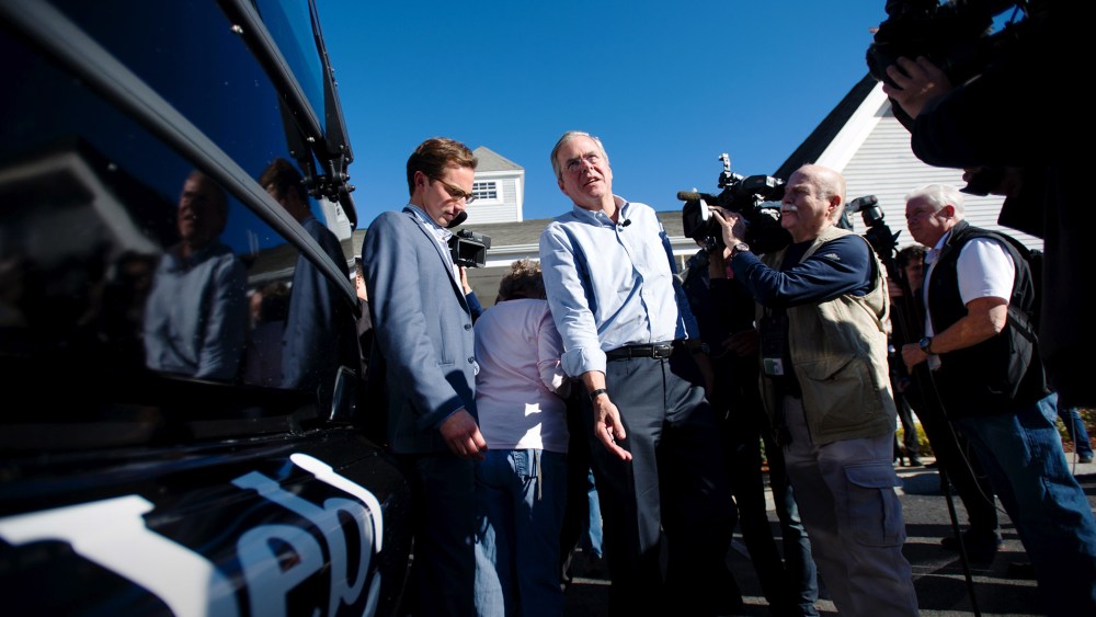 Republican presidential candidate Jeb Bush walks back to his bus after visiting Hollis Pharmacy in Hollis, N.H., Nov. 4, 2015. (Photo by Gretchen Ertl/Reuters)