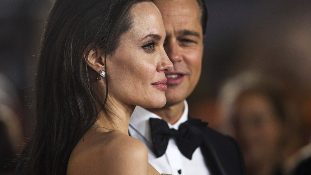 Director and cast member Angelina Jolie and her husband and co-star Brad Pitt pose at the premiere of "By the Sea" in Hollywood, Calif., Nov. 5, 2015. (Photo by Mario Anzuoni/Reuters)