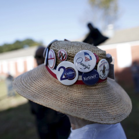 Undecided voter Mimi Dias of Charleston wears her Democratic hat before the start of a speech by U.S. Democratic presidential candidate Bernie Sanders at the annual Blue Jamboree in North Charleston, S.C., Nov. 21, 2015. (Photo by Randall Hill/Reuters)