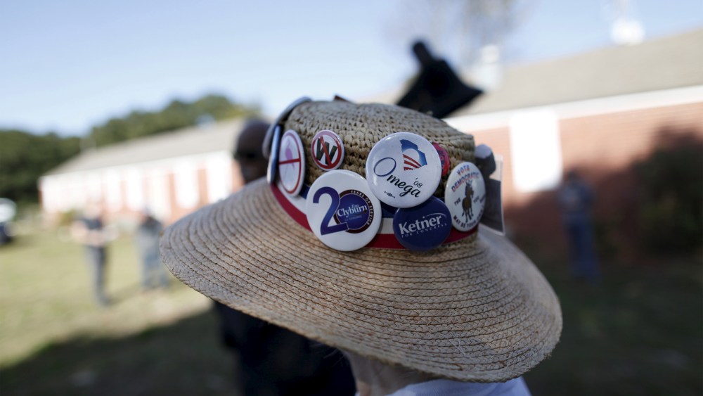 Undecided voter Mimi Dias of Charleston wears her Democratic hat before the start of a speech by U.S. Democratic presidential candidate Bernie Sanders at the annual Blue Jamboree in North Charleston, S.C., Nov. 21, 2015. (Photo by Randall Hill/Reuters)