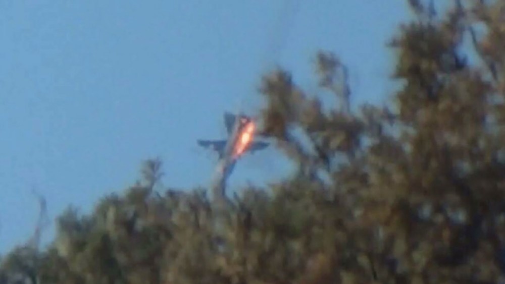A war plane crashes in flames in a mountainous area in northern Syria after it was shot down by Turkish fighter jets near the Turkish-Syrian border Nov. 24, 2015. (Photo by Stringer/Reuters)