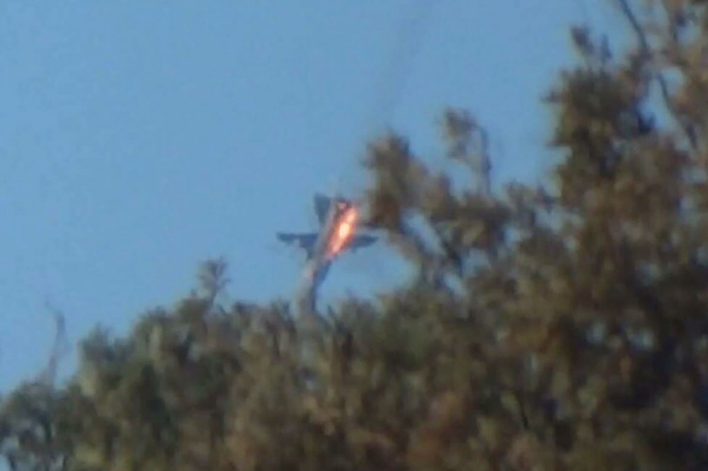 A war plane crashes in flames in a mountainous area in northern Syria after it was shot down by Turkish fighter jets near the Turkish-Syrian border Nov. 24, 2015. (Photo by Stringer/Reuters)