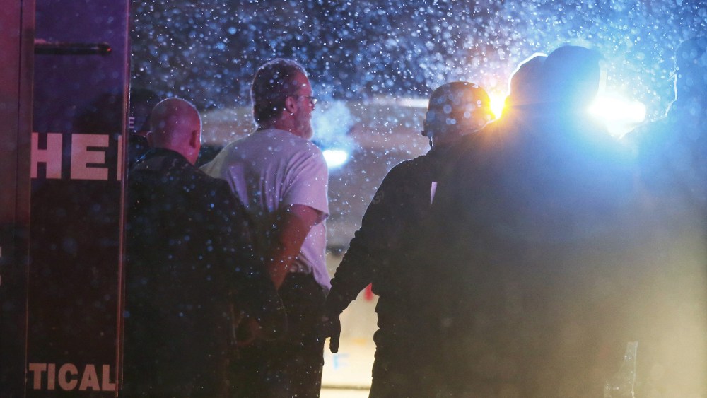 A suspect is taken into custody outside a Planned Parenthood center in Colorado Springs, Colo., Nov. 27, 2015. (Photo by Isaiah J. Downing/Reuters)