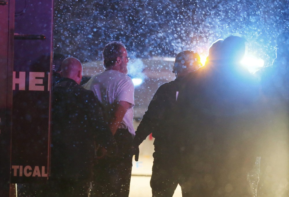 A suspect is taken into custody outside a Planned Parenthood center in Colorado Springs, Colo., Nov. 27, 2015. (Photo by Isaiah J. Downing/Reuters)