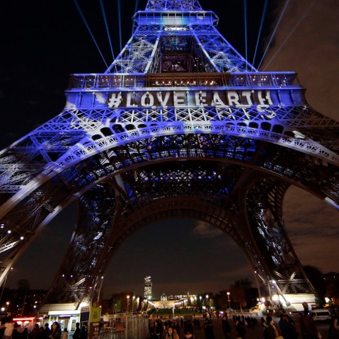 The Eiffel Tower is lit with blue lights as part of the events in the French capital to mark the World Climate Change Conference 2015 (COP21), in Paris, France, Dec. 2, 2015. (Photo by Eric Gaillard/Reuters)