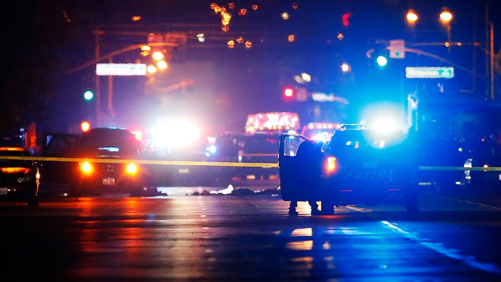 Police vehicles line the street around a vehicle in which two suspects were shot following a mass shooting in San Bernardino, Calif., Dec. 2, 2015. (Photo by Mike Blake/Reuters)
