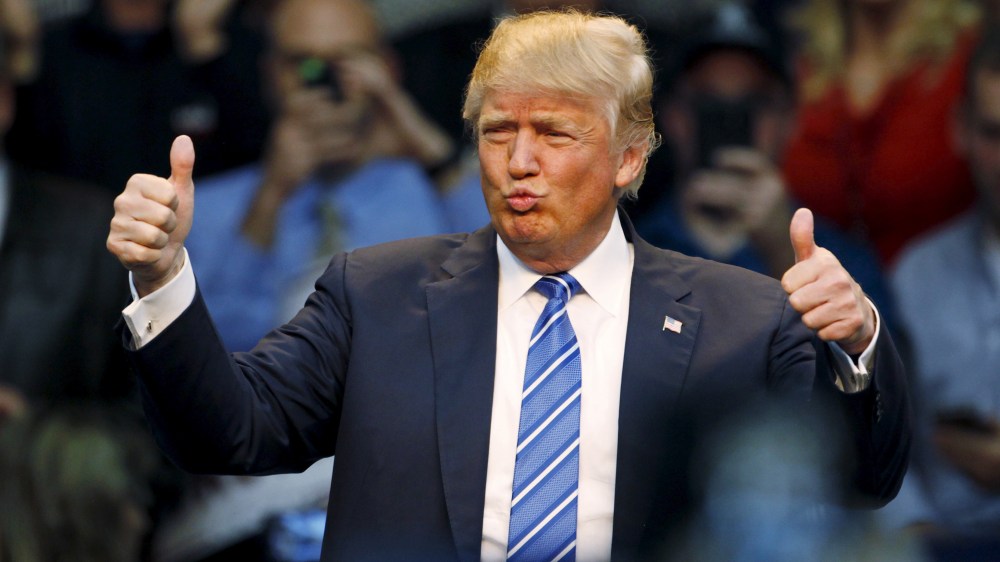 U.S. Republican presidential candidate Donald Trump reacts to supporters at the start of a Trump for President campaign rally in Raleigh, N.C., Dec. 4, 2015. (Photo by Jonathan Drake/Reuters)