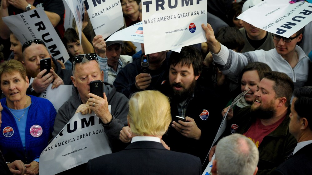 U.S. Republican presidential candidate Donald Trump greets supporters and signs autographs after a campaign stop in Spencer, Iowa, Dec. 5, 2015. (Photo by Mark Kauzlarich/Reuters)