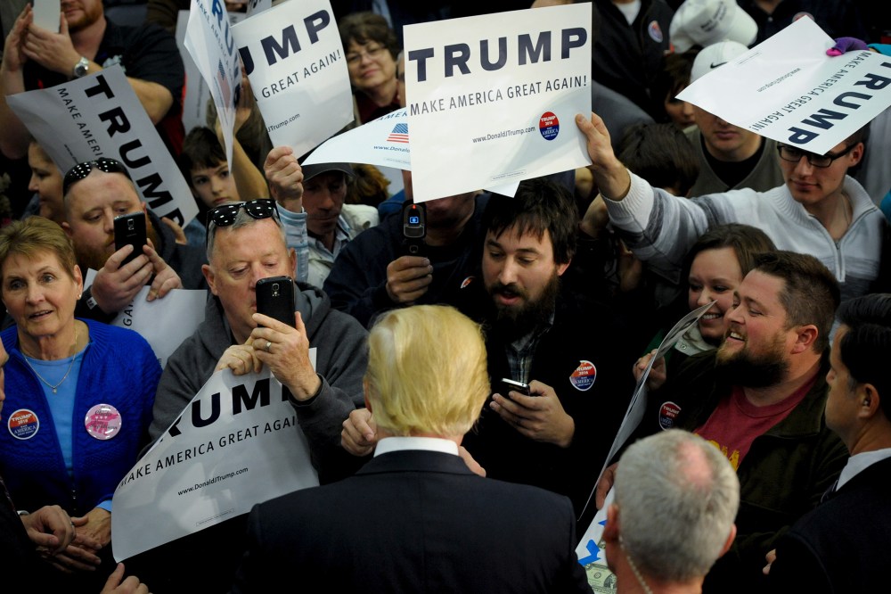 U.S. Republican presidential candidate Donald Trump greets supporters and signs autographs after a campaign stop in Spencer, Iowa, Dec. 5, 2015. (Photo by Mark Kauzlarich/Reuters)