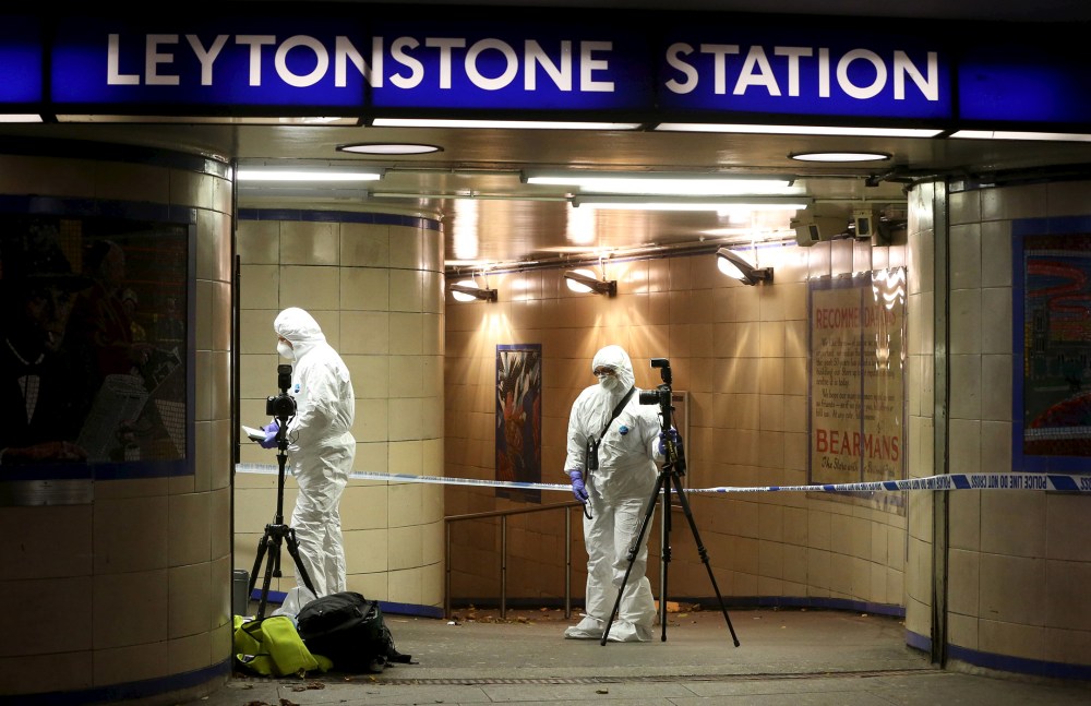 Emergency responders investigate a crime scene at Leytonstone underground station in east London, Britain, Dec. 6, 2015. (Photo by Neil Hall/Reuters)