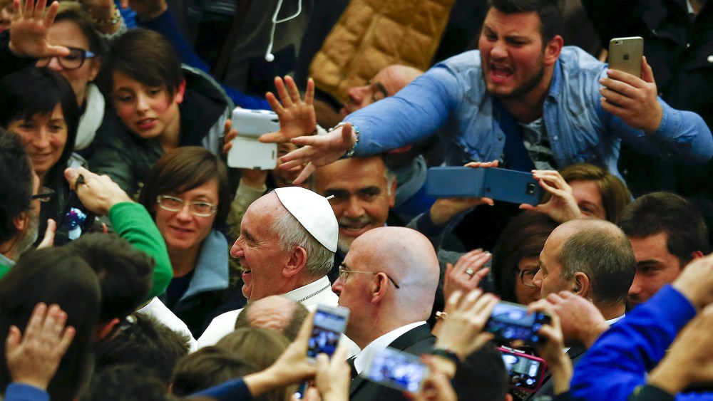 Pope Francis leaves at the end of a special audience with members of Italian episcopal conference (CEI) in Paul VI hall at the Vatican, Dec. 14, 2015. (Photo by Tony Gentile/Reuters)