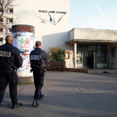 French police stand in front of the nursery school where a teacher claimed to have been assaulted by a hooded man with a knife, reportedly acting for Islamic State in Aubervilliers, near Paris, France, Dec. 14, 2015. (Photo by Charles Platiau/Reuters)