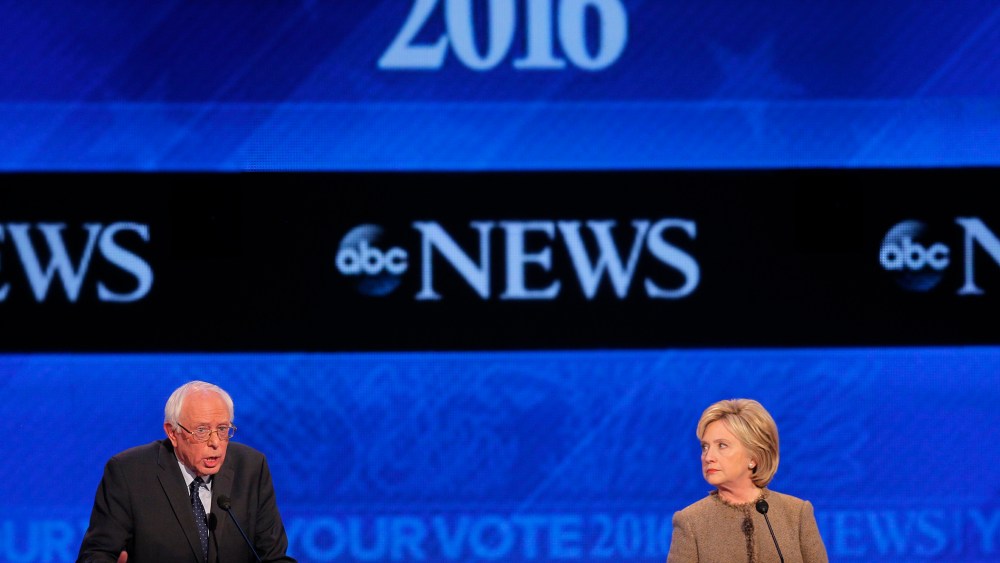 Democratic presidential candidate Hillary Clinton listens as Senator Bernie Sanders defends his positions and votes on gun control at the presidential debate at St. Anselm College in Manchester, N.H. Dec. 19, 2015. (Photo by Brian Snyder/Reuters)