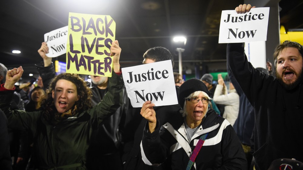 Black Lives Matter protesters chant slogans at the Mall of America light rail station in Bloomington