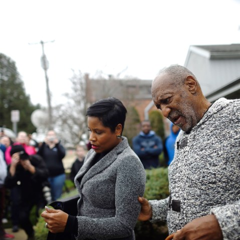 Actor and comedian Bill Cosby speaks to attorney Monique Pressley as they exit the Montgomery County Courthouse in Elkins Park, Pa., Dec. 30, 2015. (Photo by Mark Makela/Reuters)