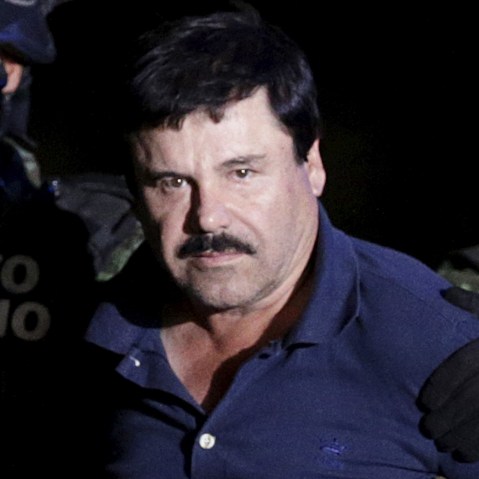Recaptured drug lord Joaquin "El Chapo" Guzman is escorted by soldiers at the hangar belonging to the office of the Attorney General in Mexico City, Mexico, Jan. 8, 2016. (Photo by Henry Romero/Reuters)