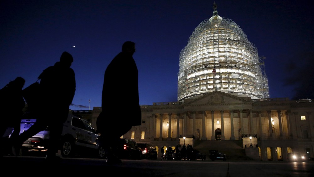 People walk past the U.S. Capitol dome in the hours before President Barack Obama delivers the State of the Union address to a joint session of Congress in Washington, Jan. 12, 2016. (Photo by Jonathan Ernst/Reuters)