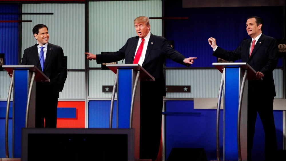 Presidential candidate Donald Trump gestures towards rivals Senator Marco Rubio and Senator Ted Cruz during the sixth Republican presidential candidates debate in North Charleston, S.C., Jan. 14, 2016. (Photo by Randall Hill/Reuters)