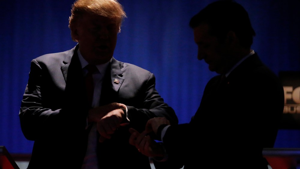 Republican U.S. presidential candidates Donald Trump and Senator Ted Cruz check their watches during a break at the sixth Republican presidential candidates debate in North Charleston, S.C., Jan. 14, 2016. (Photo by Chris Keane/Reuters)
