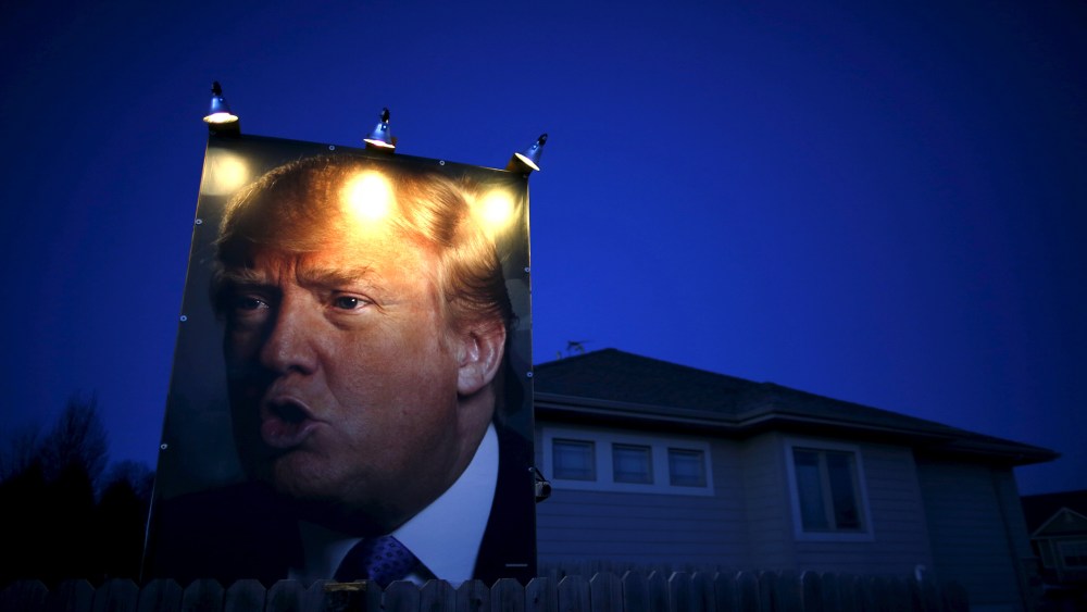 A picture of U.S. Republican presidential candidate Donald Trump hangs outside a house in West Des Moines