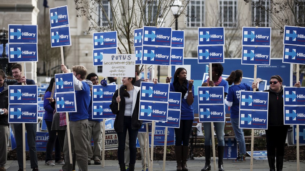 Hillary Clinton supporters stand along Calhoun Street outside the Gaillard Center before the start of the NBC News-YouTube Democratic Debate in Charleston, S.C., Jan. 17, 2016. (Photo by Randall Hill/Reuters)