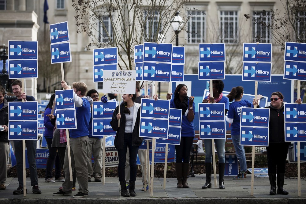 Hillary Clinton supporters stand along Calhoun Street outside the Gaillard Center before the start of the NBC News-YouTube Democratic Debate in Charleston, S.C., Jan. 17, 2016. (Photo by Randall Hill/Reuters)
