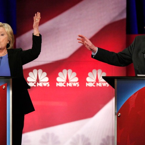 Democratic U.S. presidential candidate Hillary Clinton and rival candidate U.S. Senator Bernie Sanders speak simultaneously at the NBC News - YouTube Democratic presidential candidates debate, Jan. 17, 2016. (Photo by Randall Hill/Reuters)