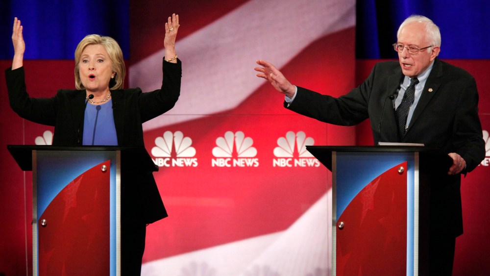 Democratic U.S. presidential candidate Hillary Clinton and rival candidate U.S. Senator Bernie Sanders speak simultaneously at the NBC News - YouTube Democratic presidential candidates debate, Jan. 17, 2016. (Photo by Randall Hill/Reuters)